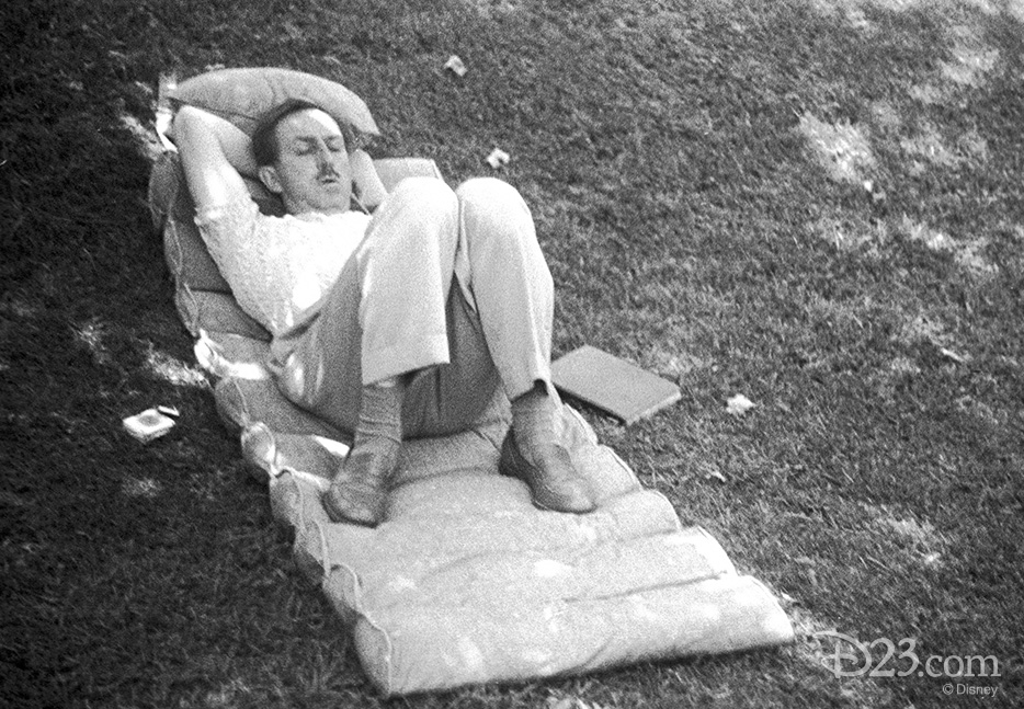 D23.com-Press-Dscovered-walts-12 This never-before-released photo, taken with Walt’s personal camera, show Walt sleeping in the shade on the lawn of his Woking Way home on a state-of-the-art '40-s cushion—a book at his side. From the “D’scovered” feature exclusively on D23.com.